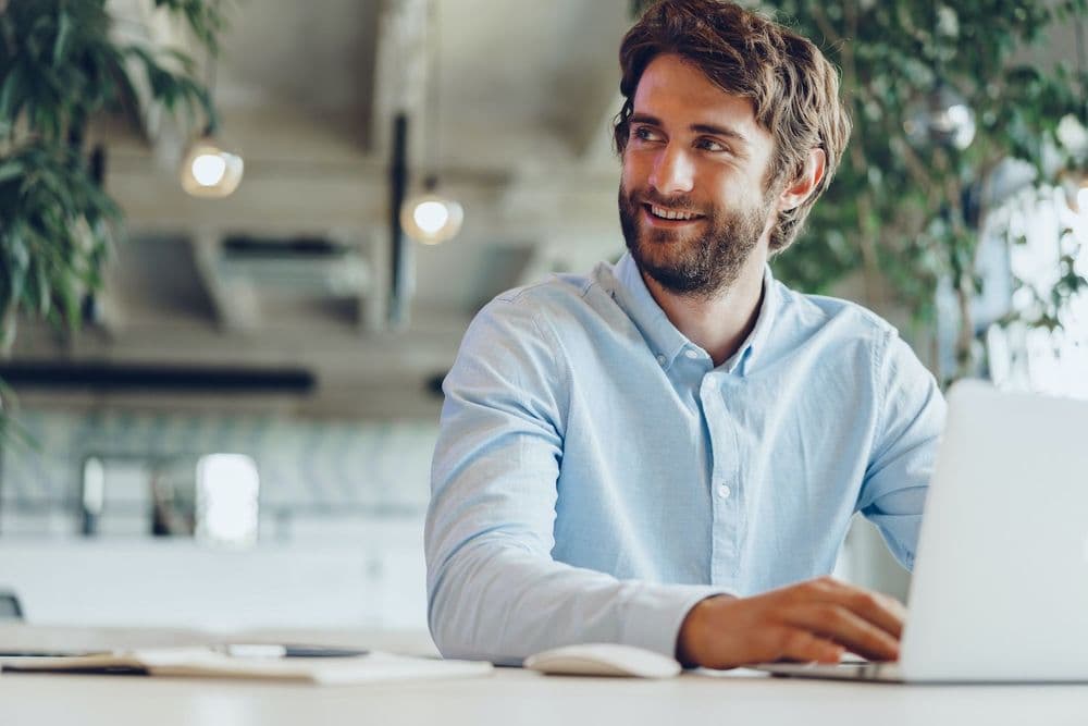 Marketer at a laptop drafting a personalized cold email
