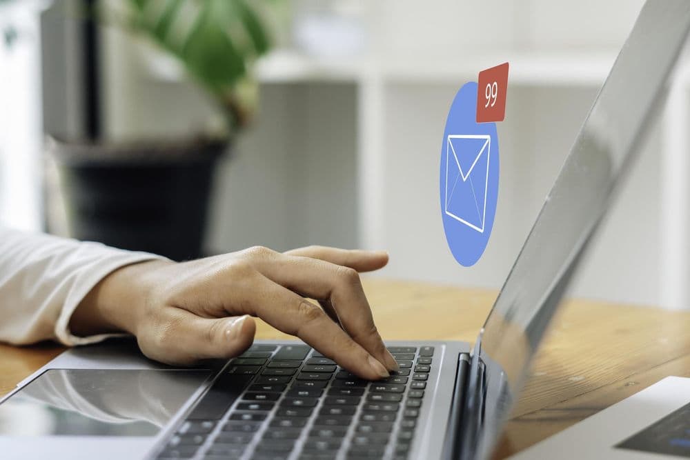 Person reading email on laptop checking inbox